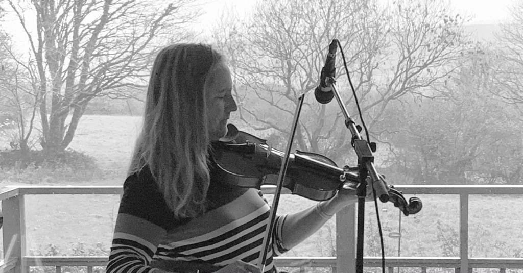 Corine Lee of Wilderness Music playing her fiddle Corine Lee of Wilderness Music playing her fiddle